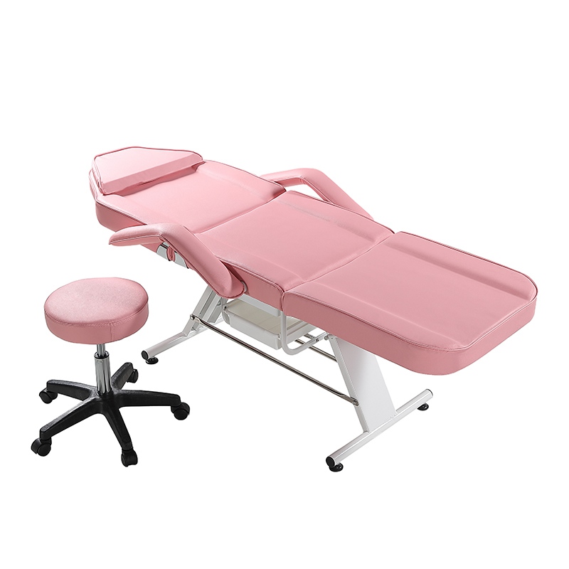 Cama de salón de belleza de color rosa con silla