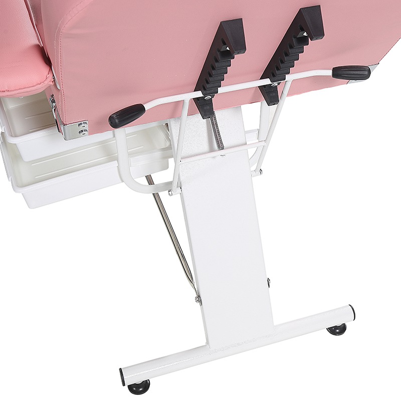 Cama de salón de belleza de color rosa con silla