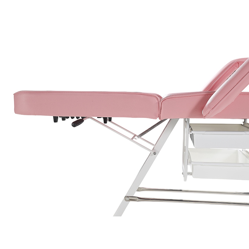 Cama de salón de belleza de color rosa con silla