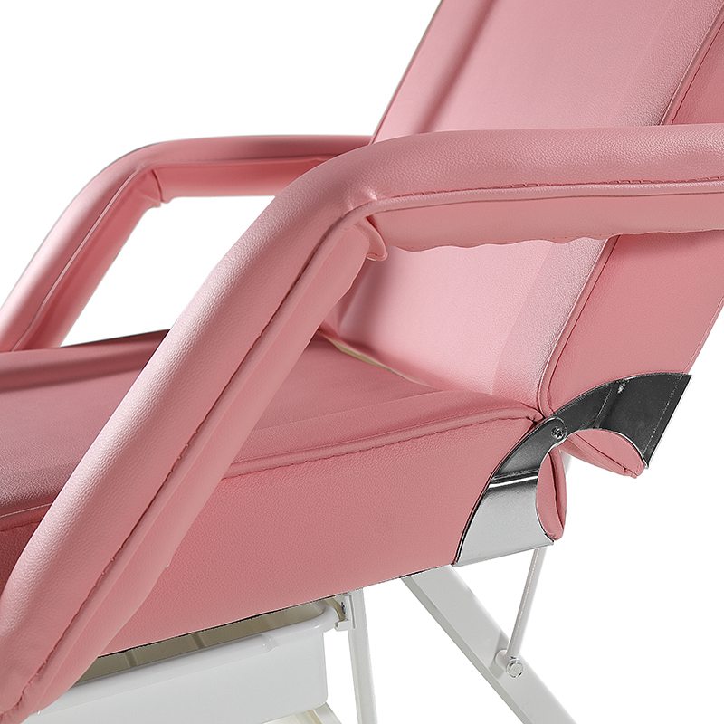 Cama de salón de belleza de color rosa con silla